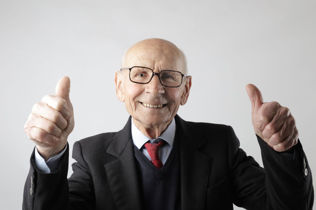 positive senior man in eyeglasses